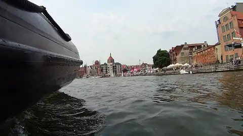 Side of a RIB on the Motława river in Gdańsk, Old Town houses in the background