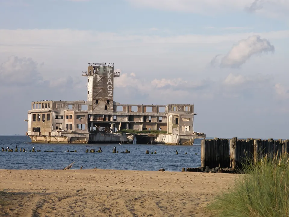 Ruins of the torpedo station in Babie Doły standing in the sea by the beach
